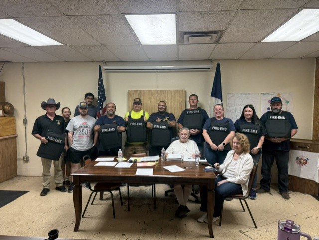 Vests marked FIRE-EMS presented to the Cameron Gardens Volunteer Fire Department
